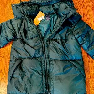 Cozy green puffer coat from the GAP. New with tags, size medium tall with hood.